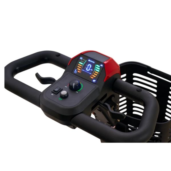 Close-up of a Golden Buzzaround XL Portable Mobility Scooter handlebar assembly with a digital display screen, control buttons, and a black plastic basket on a white background.