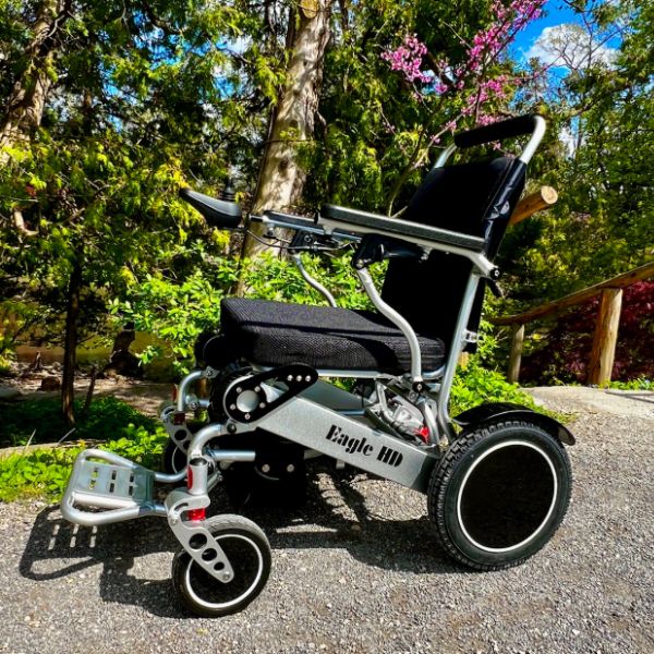 Eagle Bariatric Portable Power Wheelchair in Silver on the Road