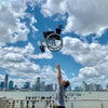 The Feather Lightweight Manual Wheelchair being thrown up in the air