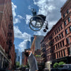 The Feather Lightweight Manual Wheelchair being thrown up in the air 