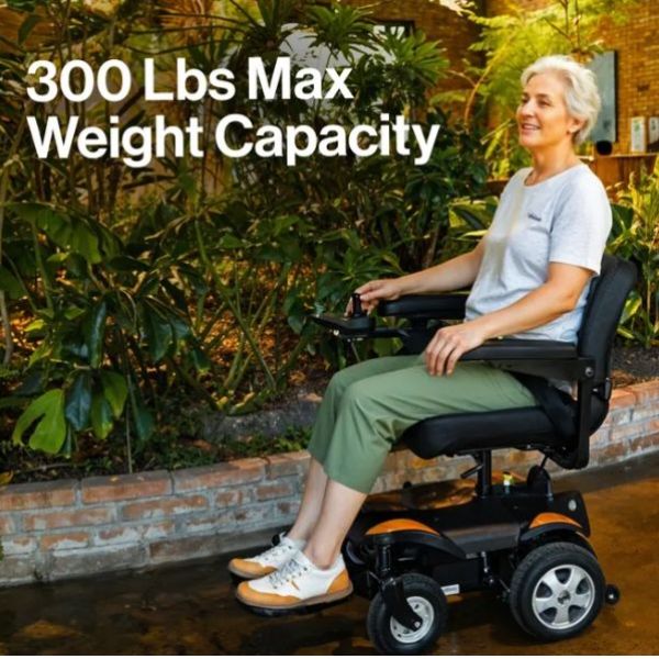 Person using SuperHandy GoRide CRZ Portable Power Wheelchair with text indicating maximum weight capacity outdoors.