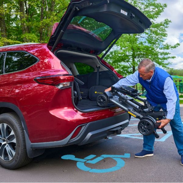 A Man Placing the GB220 Inside the Car Trunk