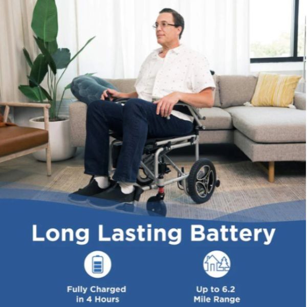 Person using  the Journey Air Lightweight Folding Power Chair in a living room with text about long-lasting battery