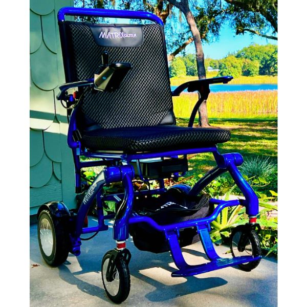 Matrix Ultra Carbon Fiber Electric Wheelchair in Blue Showing its Front View