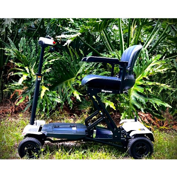 Megatrone Automatic Folding 4 Wheel Mobility Scooter on the Grass Side View