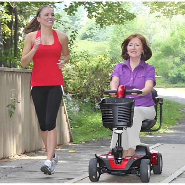 ride Go-Go Sport Platinum 4-Wheel Mobility Scooter Using by a Woman Outdoor