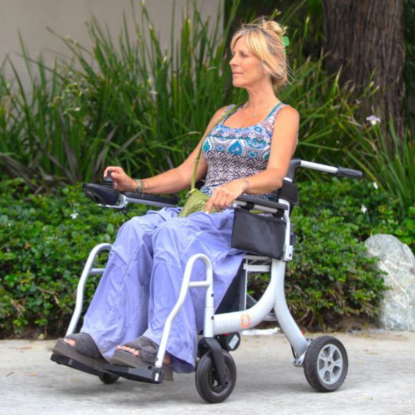 A Woman Sitting in the Reyhee Superlite Wheelchair With Her Feet Elevated