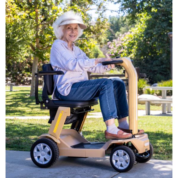 Reyhee Flex 4-Wheel Compact Travel Mobility Scooter Tan Color  with Rider