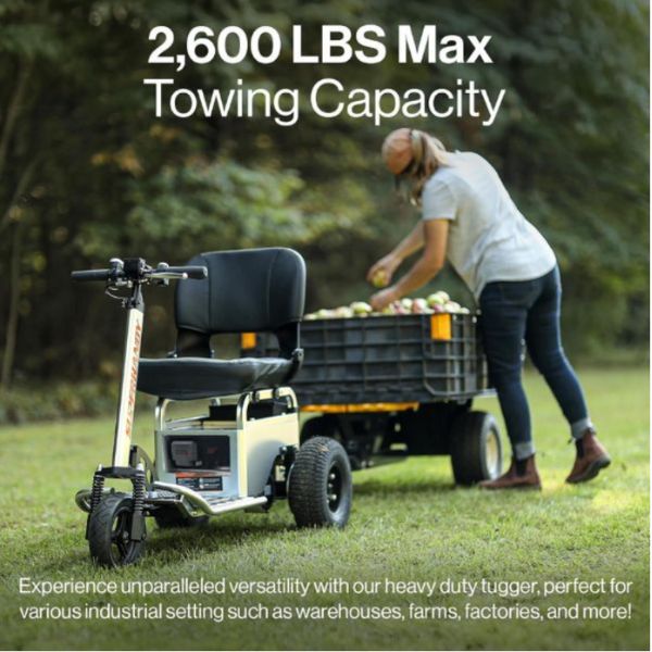 Person using a SuperHandy Electric Tugger Tow Tractor Car And Riding Scooter with a scooter attachment in an outdoor setting.