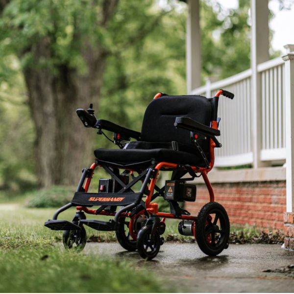 Superhandy GoRide 2 Electric Wheelchair Standing Outside the House