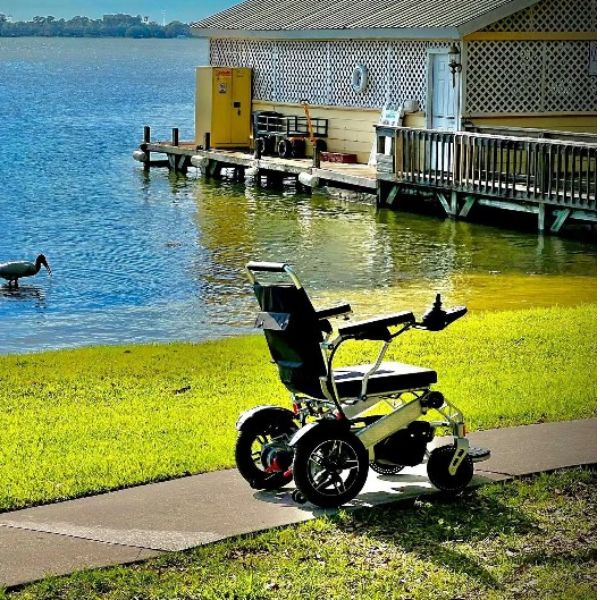 Tech 4 Remote Control Folding Power Wheelchair Beside the Sea