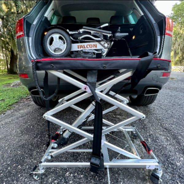 Vulcan Portable Lift Lifting a Falcon Scooter in the Trunk
