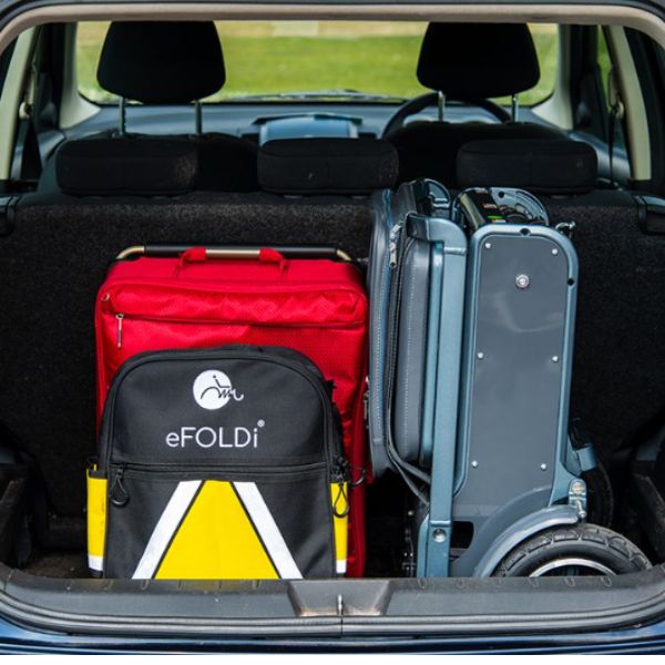 eFOLDi Explorer Ultra Lightweight Mobility Scooter in the back trunk of a car