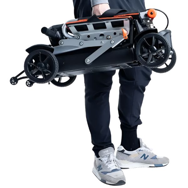 Feather Mobility 27X Compact Electric Scooter Carried By a Man