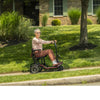 Lady riding the Feather Lightweight Electric Scooter Outdoors